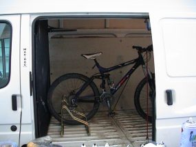 side view of bike stands in van